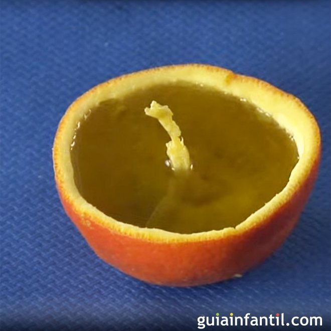 Vela de aceite en una naranja. Experimentos para niños